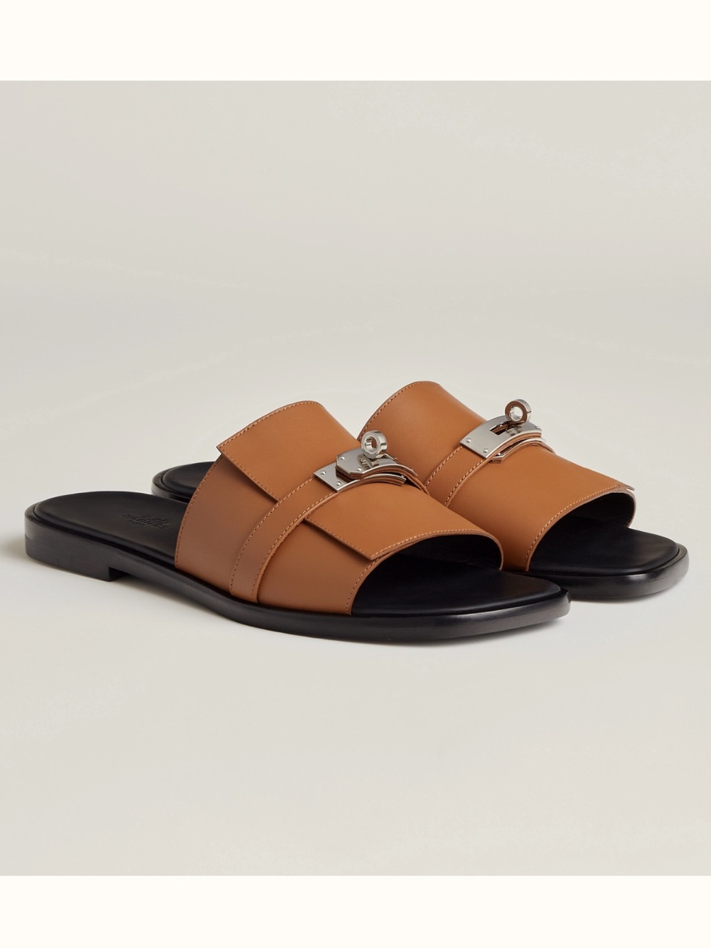 HERMÉS Men's Tan Leather Slide Sandals with Palladium-plated Kelly Buckle